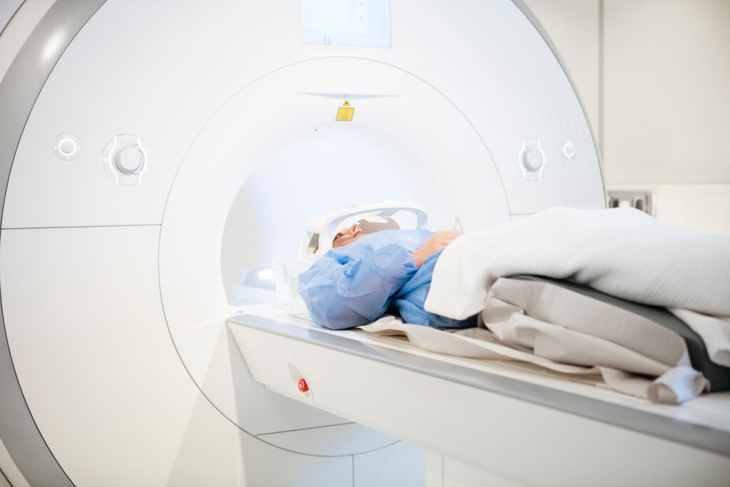 Patient undergoing MRI scan on advanced imaging machine at TaylorMed MRI